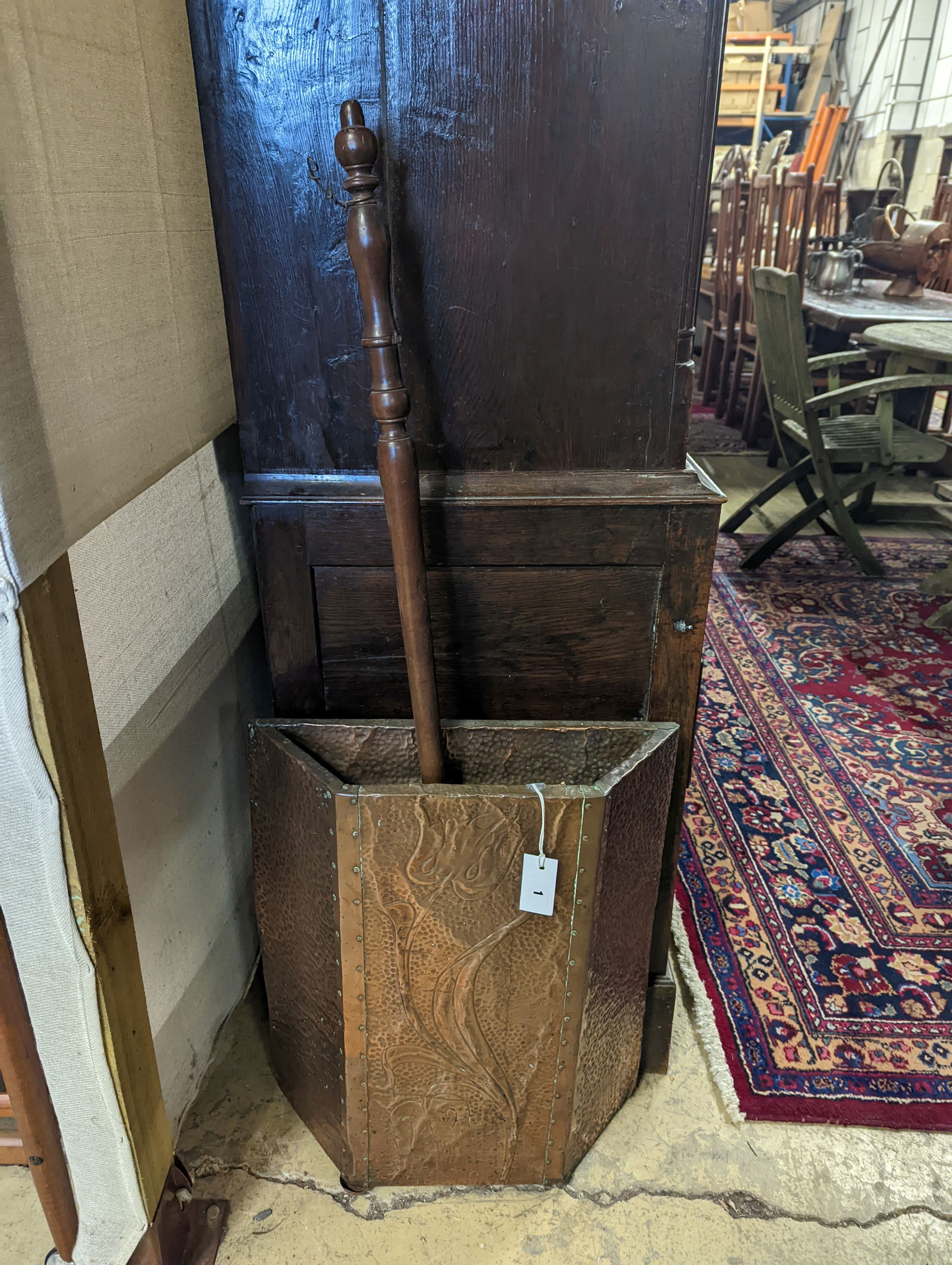 An early 20th century embossed copper stick stand, height 60cm, together with a Victorian copper warming pan